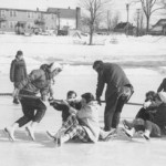 During the '59 carnival, participants of all ages fight for traction in a tug-of-war on "The Puddle."