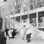 Parker Hall East residents put the finishing touches on the dinosaur that won them the 1939 snow sculpture competition.