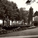 Then: (May) The end of the beginning: Luxuriant spring foliage makes the backdrop for a Commencement procession to the Chapel.  Photographer unknown, 1930s photo, gelatin silver print, the Edmund S. Muskie Archives and Special Collections Library.