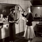 Then: (August) With radio still in its prime a half-century ago, and even the subject of a speech department course, the College studio in Chase Hall was a happening place at Bates.  Photograph by William M. Rittase, circa 1950, gelatin silver print, the Edmund S. Muskie Archives and Special Collections Library.