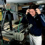 Now: (August) Though radio is no longer part of the formal Bates curriculum, student-run WRBC-FM remains a hot spot of campus interest. Here, Kristen O'Toole '02 is shown at the board during her weekly show.  Photograph by Phyllis Graber Jensen.