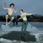 Now: (February) Adam Dengler '07 and Teah Muller '07 take the plunge in 2004 during the annual Puddle Jump.  Photograph by Phyllis Graber Jensen.