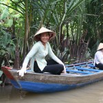 Young Ladies on the small boat, on a cannel, Mekong Delta.