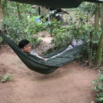 Visting Cu Chi Tunnels, Prof. Trian Nguyen resting in hammock.