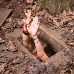 Visting Cu Chi Tunnels, Ali in the tunnel.