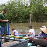 Students taking a tour boat, in a cannel, Mekong Delta.