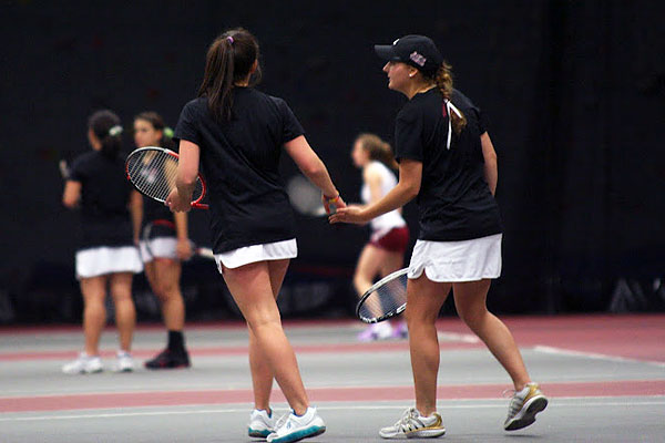 Meg Anderson '12 and Elena Mandzhukova '15 (right) have become Bates' first women selected to play in the NCAA Division III Women's Tennis Championship, at doubles. (Bates Tennis Blog file photo)