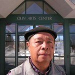 Nano S. poses in front of Olin Arts Center