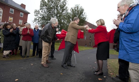 Professor of Philosophy Mark Okrent gets a close look as board chairman Mike Bonney '80 (left) and President Nancy Cable do the ribbon cutting. Photograph by Rene Minnis.
