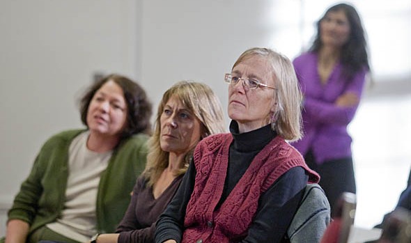 From left, Mary Rice-DeFosse, Francisca López, and Jane Costlow listen as Rhea Coté Robbins reads one of her poems.