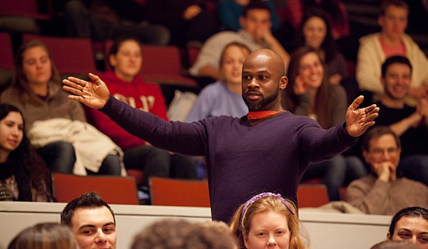 Marc Bamuthi Joseph engages with his audience in the aisles of the Olin Arts Center Concert Hall. (Photographs by Phyllis Graber Jensen)