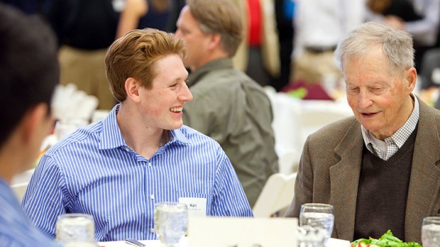 Karl Fisher '14, left, talks with Charles E. Clark '51 at the Mount David Society Scholarship Luncheon on March 30. Clark is the author of Bates Through the Years: An Illustrated History, as part of the college's sesquicentennial.