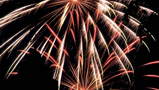 Hathorn Hall is silhouetted against a Bates fireworks display. Photograph by Ken Zirkel.