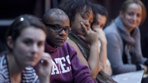 For Short Term 2012, the annual theater production workshop is adapting for the stage a spoken-word piece by Marc Namuthi Joseph. Shown listening to Joseph during a class session are, from left, Katie Straw '12, Yasin Fairley '12, Ashley Booker '12, dance professor Rachel Boggia and theater lecturer Kati Vecsey. Photograph by Phyllis Graber Jensen/Bates College.