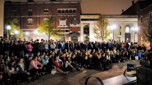 A Bates crowd at the Courthouse Plaza on Lisbon Street listens to the all-college a cappella performance that concluded the 2012 "College Night in Town." Photograph by Michael Pasek '12.