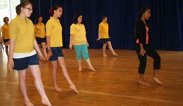 Victoria Lowe '12, at right, leads a dance class during her 2012 internship at the Tacchi-Morris Arts Centre in Taunton, U.K.