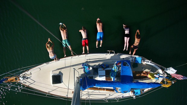 Members of the 2008 AESOP trip dive into the frigid waters of the New Meadows River near Bath, Maine. From left: co-leader Emily Chandler '09, co-leader Lincoln Benedict '09, Ben Williams '12, Stephen Wright '12, Erin Pinover '12 and Monica Rodriguez '12. Standing near the stern is Maria Rouvalis '12.