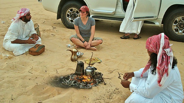 Anthropology major Devin Tatro '14 talks with Saudi men at a desert farm in the Eastern Province during a Short Term trip last spring to Saudi Arabia led by Dana Professor of Anthropology Loring Danforth. This was a rare moment in Saudi society: women talking with men publicly and allowed not to wear abayas. Photo: Ana Bisaillon ’12.