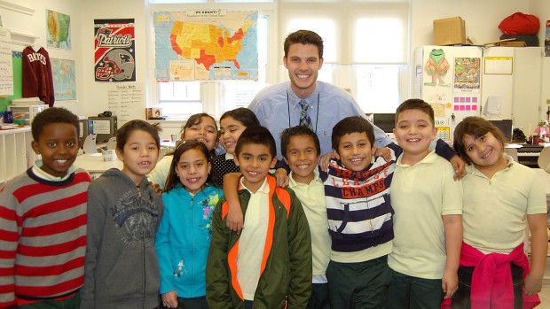 All smiles, Drew Gallagher '11 poses with a group of his students at Bruce-Monroe Elementary School in Washington, D.C. Photo courtesy of Drew Gallagher '11.