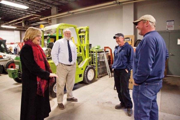 Spencer visits Cutten Maintenance Center to thank staff for turning the Gray Athletic Building into a grand venue for the presidential announcement. From left, Dan Nein, Mike Adams and John Griffiths. Photograph by Phyllis Graber Jensen/Bates College.