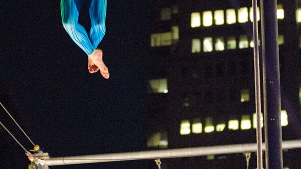 At the apogee of an upswing, Jones is poised to catch the next student flying his way at the South Street Seaport location of the Trapeze School New York.
Photograph by Phyllis Graber Jensen