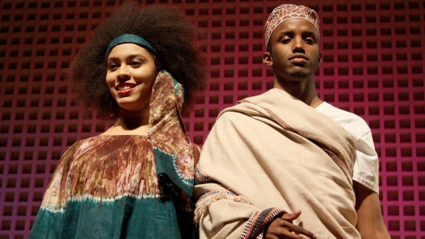 At Bates College's 2012 Inside Africa Fashion Show, sophomore Nerissa Brobbey models a Togolese boubou dress with matching head scarf. At right, Gulaid Abdullahi wears a traditional ma'awis and kofia hat. Photograph by Simone Schriger '14/Bates College.