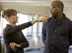 Choreographer and dancer Erin Gottwald '98 confers with rapper, writer, actor and director Postell Pringle '98. The classmates are on campus to lead longstanding Short Term unit "Tour Teach Perform," in which students create a dance piece and teach it to pupils in local schools. (Phyllis Graber Jensen/Bates College)
