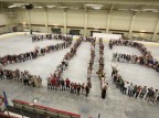 The members of the Bates Class of 2013 gathered in Underhill Arena on Friday, May 24 for their class photo. Photo by Mike Bradley/Bates College.