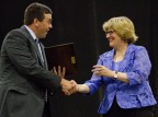 Brad Adams '92 is congratulated by President Clayton Spencer as he receives the Stangle Award for Distinguished Service to the Bates Community on June 8, 2013, at Reunion. Photograph by Phyllis Graber Jensen/Bates College.