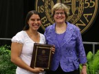 Julia Sleeper '08, recipient of the Distinguished Young Alumni Award at Reunion for her work with Tree Street Youth Center in Lewiston, poses with President Clayton Spencer. Photograph by H. Lincoln Benedict '09.