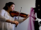 So Hee Ki ’16 of Irvine, Calif., practices Richard Wagner’s “Siegfried-Idyll” on the viola in the Olin Arts Center. (Phyllis Graber Jensen/Bates College)