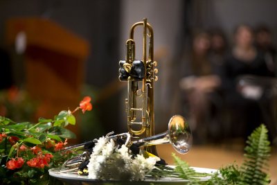 Trumpets belonging to the late James Jhun ’16 are displayed during the memorial service and celebration of his life on Jan. 22 in the Olin Arts Center Concert Hall. (Phyllis Graber Jensen/Bates College)