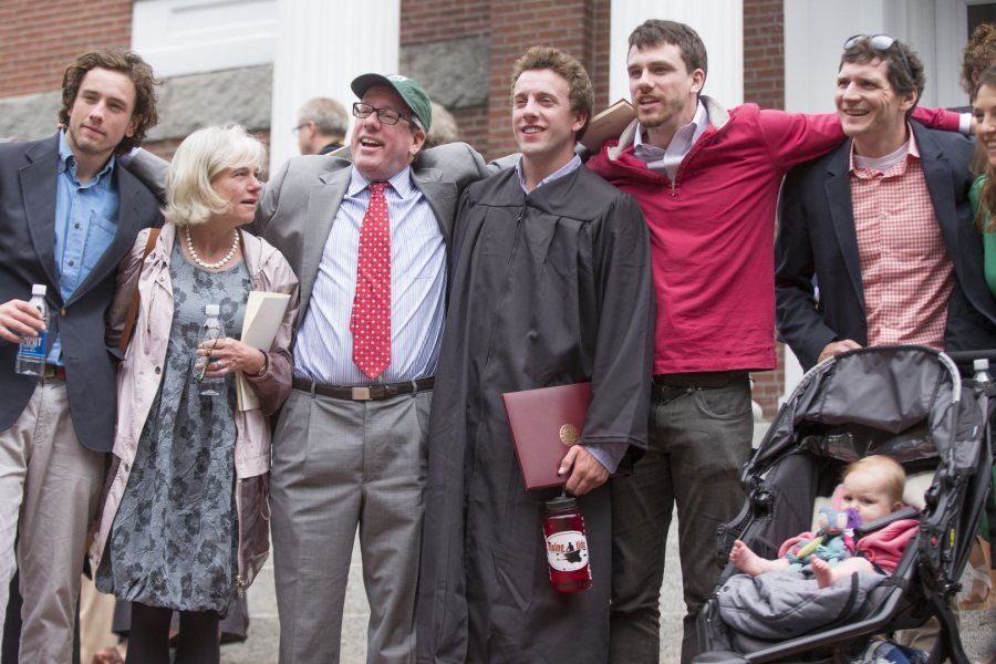 William Cleaves ’16 gathers with members of his family, including cousin John McDevitt ’04 (far right) and his daughter, Norah, 7 months, for a post-Commencement photograph on the steps of Hathorn Hall. (Phyllis Graber Jensen/Bates College)