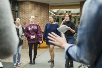 Co-musical director Audrey Burns '17 of Topsham, Maine, encourages the group to listen to each other.