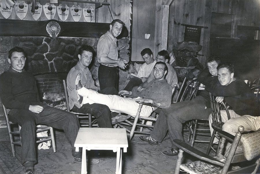 Bates football players relax in the lodge of Camp Wonalancet in Eaton Center, N.H. during their preseason training, circa September 1939. (Photograph by Richard Bowers Oliver)