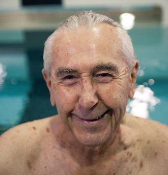 Master relay swimmer John White '39 swims daily. Master relay swimmer John White '39 swims daily.