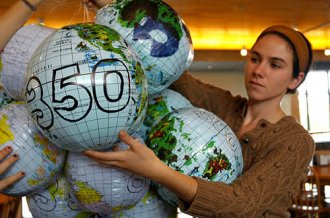 Hannah Porst with 350.org globes Hannah Porst with 350.org globes