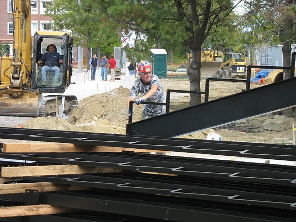 A worker wrangles a steel component for the Garcelon Field grandstand as it's unloaded on Sept. 15, 2010. A worker wrangles a steel component for the Garcelon Field grandstand as it's unloaded on Sept. 15, 2010.