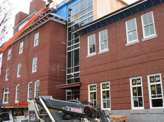 In color and detail, the recently finished brickwork on the addition to Roger Williams Hall, at right, resembles the walls on the original structure. Photographed April 28, 2011. In color and detail, the recently finished brickwork on the addition to Roger Williams Hall, at right, resembles the walls on the original structure. Photographed April 28, 2011.