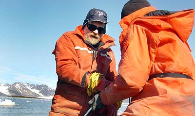 In Kongsfjorden on the west side of Svalbard, Will Ambrose (facing) and Kelton McMahon ’05 haul a dredge to collect Serripes groenlandicus and other clam species for McMahon’s thesis in 2004. Photograph by Glenn Lopez, SUNY–Stony Brook.
