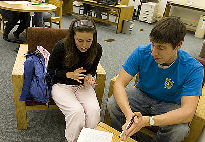 In Ladd Library’s Peer Writing Center, tutor Jon Blanchard ’08 of Tewksbury, Mass., works with Alie Schwartz ’08 of Charlotte, N.C. She’s writing a classics honors thesis (Omens: The Undiscovered Voice of the Common Roman) and sought advice on how to make her writing understandable and clear to the everyday reader. Photograph by Phyllis Graber Jensen.
