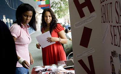 As part of her pschology course, Lisa DOyen works at an HIV/AIDS awareness table in the college center at Spelman College, the historically black womens college in Atlanta.