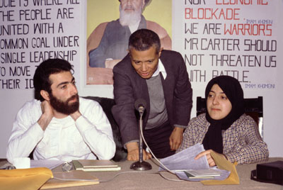 In this photograph by Randy Goodman, William Worthy (center) sets up a question-answer session at a Tehran hotel with Hossein Sheikholislam (left) and Massoumeh Ebtekar (right), spokespeople for the students who held 52 U.S. diplomats hostage for 444 days.