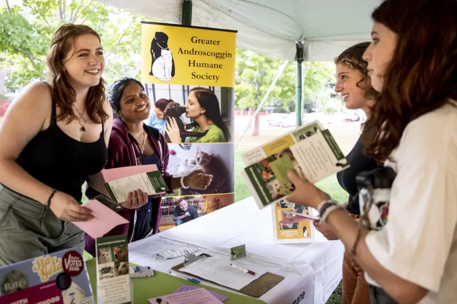 Community engagement was on display last Wednesday, Sept. 9, at the Volunteer Fair in the Bardwell Field Tent.

Maggie McCulloch ’23 and Arya Mohanty ’22, volunteers for the Greater Androscoggin Humane Society, recruited Avrah Ross ‘23 and Ava Axelrod ’23 to join the effort.

Sponsored by the @harwardcenter for Community Partnerships, the fair provided Bates students, both new and returning, the chance to learn about ways to get involved with off-campus organizations, including work around tutoring, mentoring, food, senior citizens, the arts, legal reform, conservation, refugee and immigrant support, animal welfare, and more.

Those who attended learned about ways Bates students support local organizations, as well as the wonderful service these organizations provide for the people of Lewiston-Auburn.

Those present included Darby Ray, Martha “Marty” Deschaine ’75, Sam Boss, and Hamza Abdi.