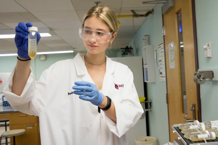 Emily Tamkin '22, a biology major from Lafayette, Calif., is doing a summer '21 purposeful work internship tin brewing science, partnering with the Baxter Brewing Co. in Lewiston, where she's studying the number of battering compounds that exist in beer throughout the brewing process. She is working under the supervision of Merritt Waldron, Baxter's quality control manager, and Assistant Professor of Biology Lori Banks.  Emily picks up samples from Baxter's plant at 130 Mill Street in Lewiston and takes them to Carnegie Science where, in Dr. Bank's lab, she conducts a chemical analysis of them. The compounds hit your taste buds, and your brain understands that they are bitter, she says.