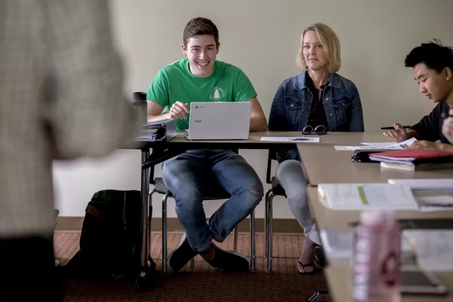 Back To Bates offers opportunities for visiting family members to attend classes on Friday afternoon.
GER 101 - Intro German Language & Culture I
This course, part of a yearlong sequence, introduces students to the German language and its cultural contexts. By emphasizing communicative skills, students learn to speak, build vocabulary, and develop their listening comprehension, reading, and writing skills. GER 101 is only offered in the fall semester. GER 101 is not open to students who have had two or more years of German in secondary school. 

Jakub Kazecki, Assistant Professor of German

June Donenfeld, mother of Kiyona Mizuno '18 of San Francisco (her daughter is not in the class)

Christine Master in jean jacket with son Alex '19 of Haddon Heights, N.J.

Laurie Edson with gray/black dress and scar with son Tim Edson '21  of Lexington, Mass.