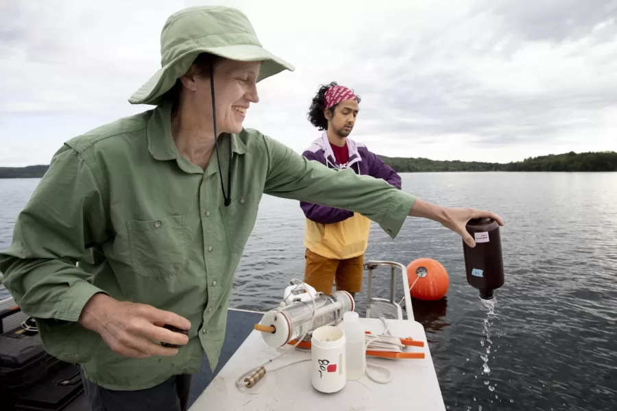 Supervised by Holly Ewing, Christian A. Johnson Professor of Interdisciplinary Studies, environmental studies major Christopher Castaneda ’20 takes water samples from Lake Auburn. He’s studying nutrients produced by algae and consumed by other organisms in the lake. Related to the impacts of algae blooms on water quality, the research supports community efforts to deliver unfiltered public water at the lowest price. 

On the boat with 
Water treatment manager and lab director Chris Curtis (in blue shirt) and Lindsay Bates and Dan Fortin, water quality technicians (Bruins sweatshirt)