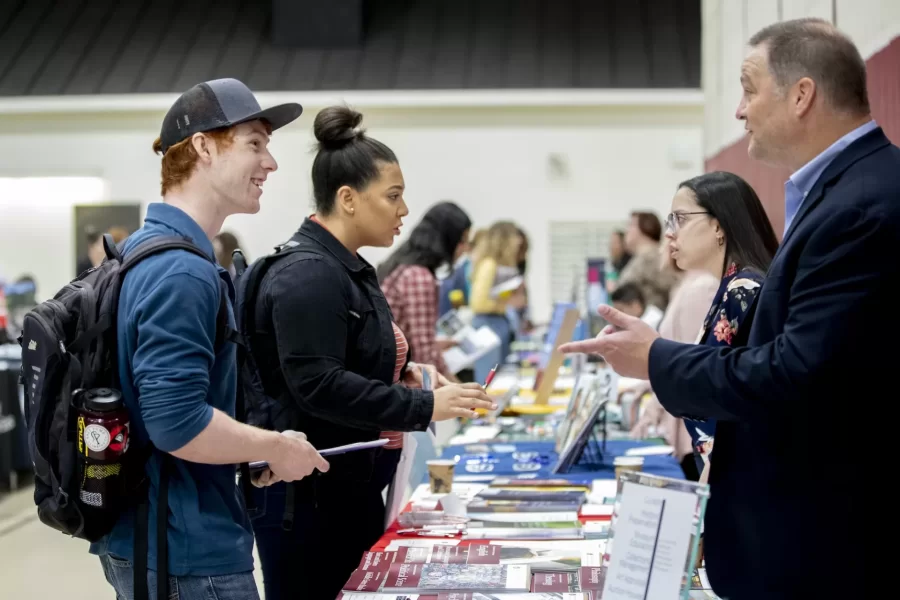Sheridan Frank ‘20 of Round Lake Beach, Ill., and Mitchell Willsey ‘20 of Glastonbury, Conn., discuss programs with graduate school admission reps today in the Clifton Daggett Gray Athletic Building.
.
Frank is interested in doctoral programs in clinical psychology, Willsey in Ph.D. programs in chemistry.
.
Each fall, more than 80 graduate and professional schools come to Bates, where students, faculty, staff and the public are invited to meet with admissions representatives to learn about the variety of programs offered, individual program admissions requirements, and what distinguishes one program from another.