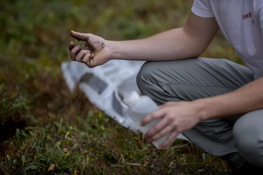 Zoe Knauss '23 of Buffalo, N.Y.,  who will declare as an ES major, and ES major Sam Gilman '22 of Mendham, N.J., , dig for soil in a field.


Prof of Environmental Studies and Christian A. Johnson Prof of Interdisc Studies Holly Ewing and Lecturer in Environmental Studies & Learning Associate in Environmental Studies Camille Parrish take students in the Soils/Lab course for a field trip to Pettengill Farm in Freeport, Maine. A nineteenth century salt-water farm on the estuary of the Harraseeket River, the farm is owned by Freeport Historical Society(FHS). It includes a saltbox house (ca. 1800) on 140 acres of fields, woods, antique apple orchards and salt marsh. Most interesting are the etchings (sgraffitti) found on the plaster walls in the upper chambers of ships, sea monsters, longboats and animals. The farmhouse remains without plumbing, central heat and electricity and is listed in the National Register of Historic Places. Mildred Pettengill was its last resident and lived in the house until 1970.

The students are digging up soil and making observations (soil profiles) before putting it back where it came from.

ENVR 310 - Soils/Lab
Depending on one's point of view, soils are geological units, ecosystems, the foundation of plant life, a place for microbes to live, building material, or just dirt. This course takes a scientific perspective and explores the genesis of soils, their distribution and characteristics, and their interaction with plants. Field studies emphasize description of soils, inferences about soil formation, and placement within a landscape context. Labs investigate the chemistry of soils and their role in forestry and agriculture.