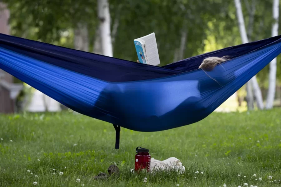 Spotted at Bates: Annie Conway '23 of South Salem, N.Y., enjoying a novel on Alumni Walk, and Ben Fasciano '23 of Lincoln, Mass., and Andrew Hoffman ‘23 of Oak Park, Ill., playing disc golf on Lake Andrews.

They're each living in Lewiston during the summer for jobs and internships. And making the most of a beautiful, quiet campus.